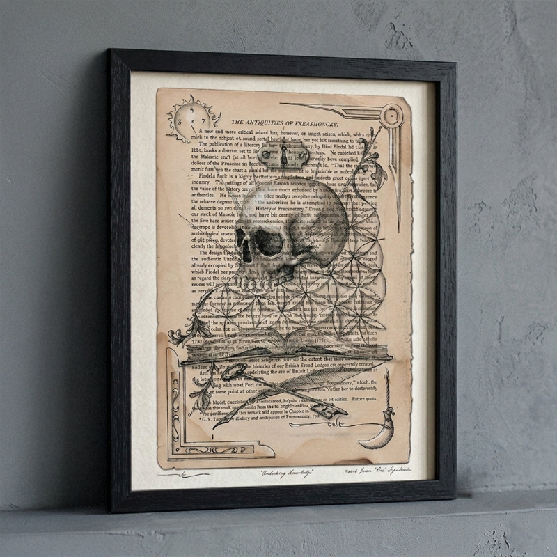 Unlocking Knowledge freemasonry artwork print by Juan Sepulveda, displayed in a black frame against a gray plaster wall.