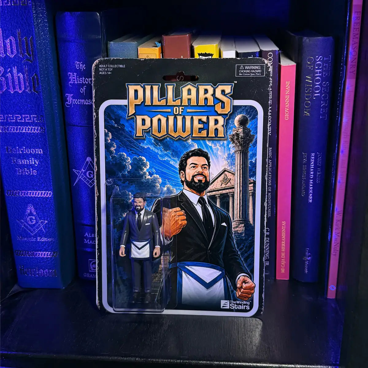 Carded Bro. John Stone figure on a bookshelf